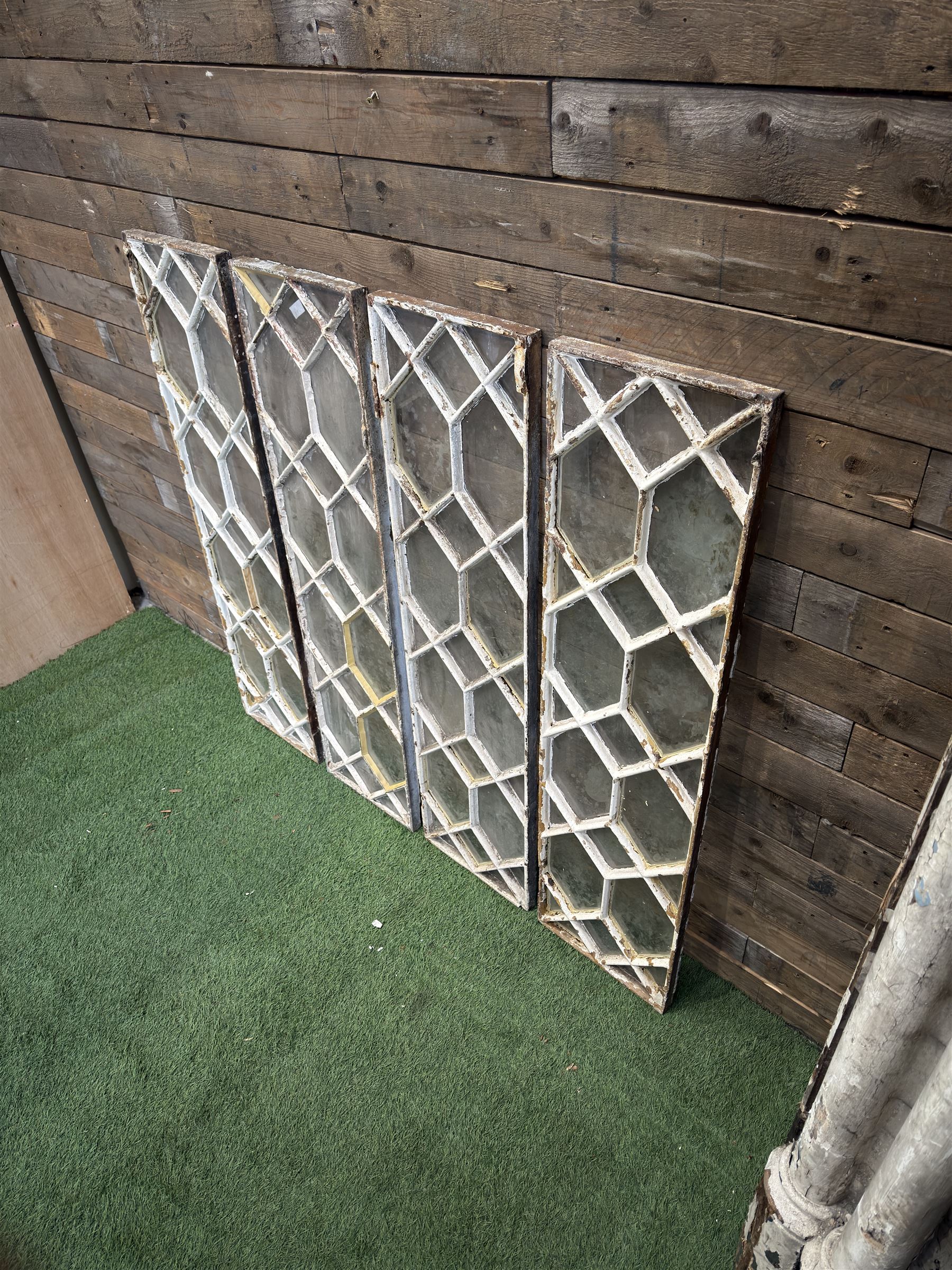 Four 19th century cast iron windows, lattice glazed in white painted finish, 