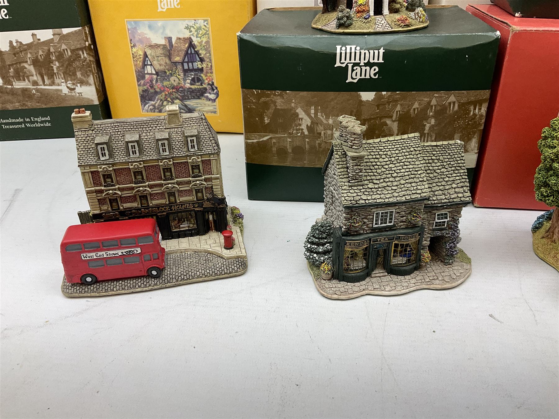 Fourteen Lilliput Lane cottages to include 'Diamond Cottage', 'Kendal Tea House', Visitor's Centre Special 'It's For You' signed to base, The British Collection 'The Sherlock Holmes' etc, all boxed with deeds