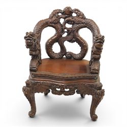 Chinese carved hardwood dragon throne chair, the shaped and pierced back with entwined dragons and cloud motifs, sweeping dragon-form arms terminating in carved heads, solid panel seat over foliate carved apron, on four mask carved cabriole supports