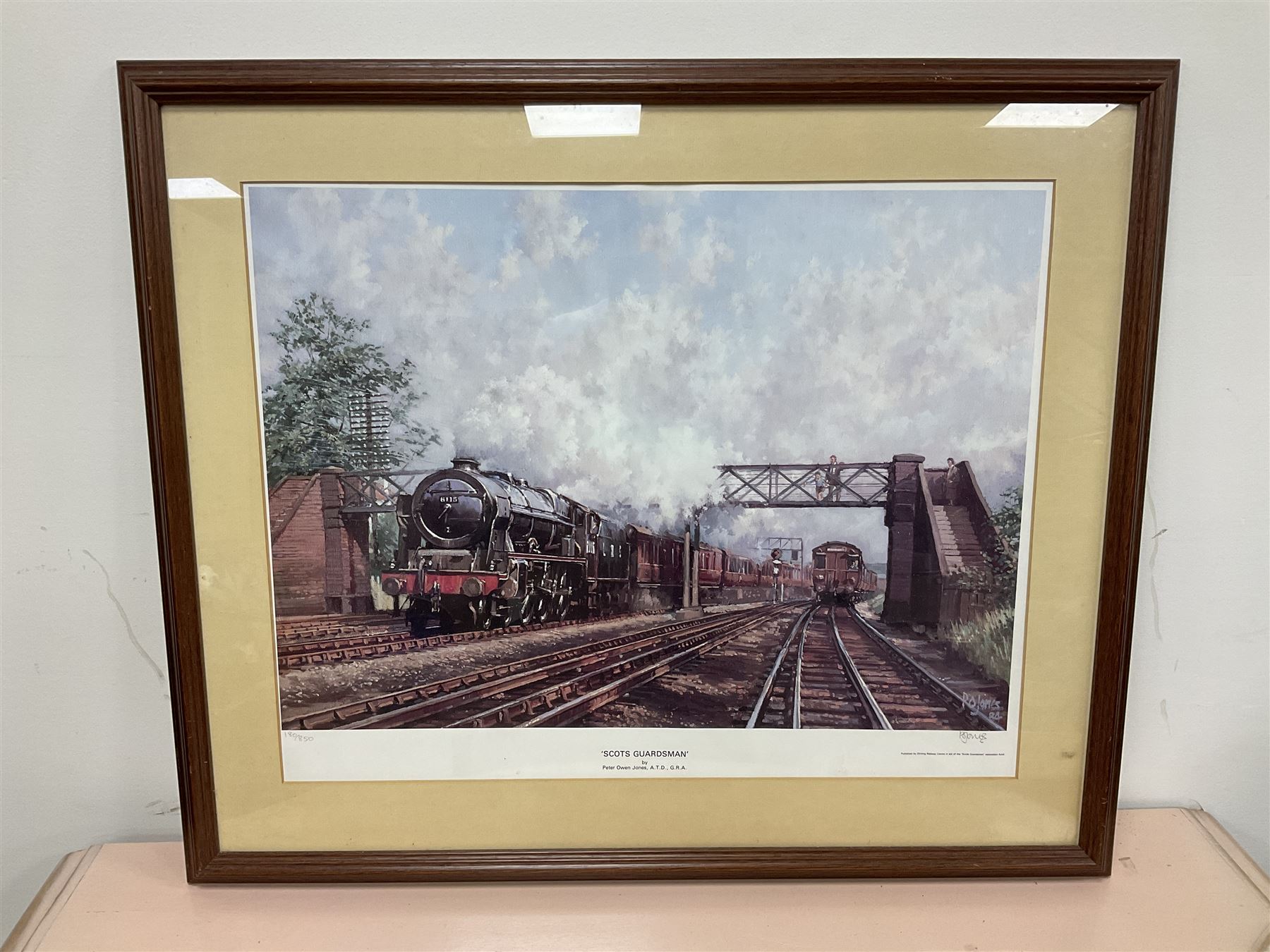After Peter Owen Jones (British 20th century), 'Scots Guardsman'; limited edition colour print signed in pencil, together with three colour prints of early 20th century steam trains (4)