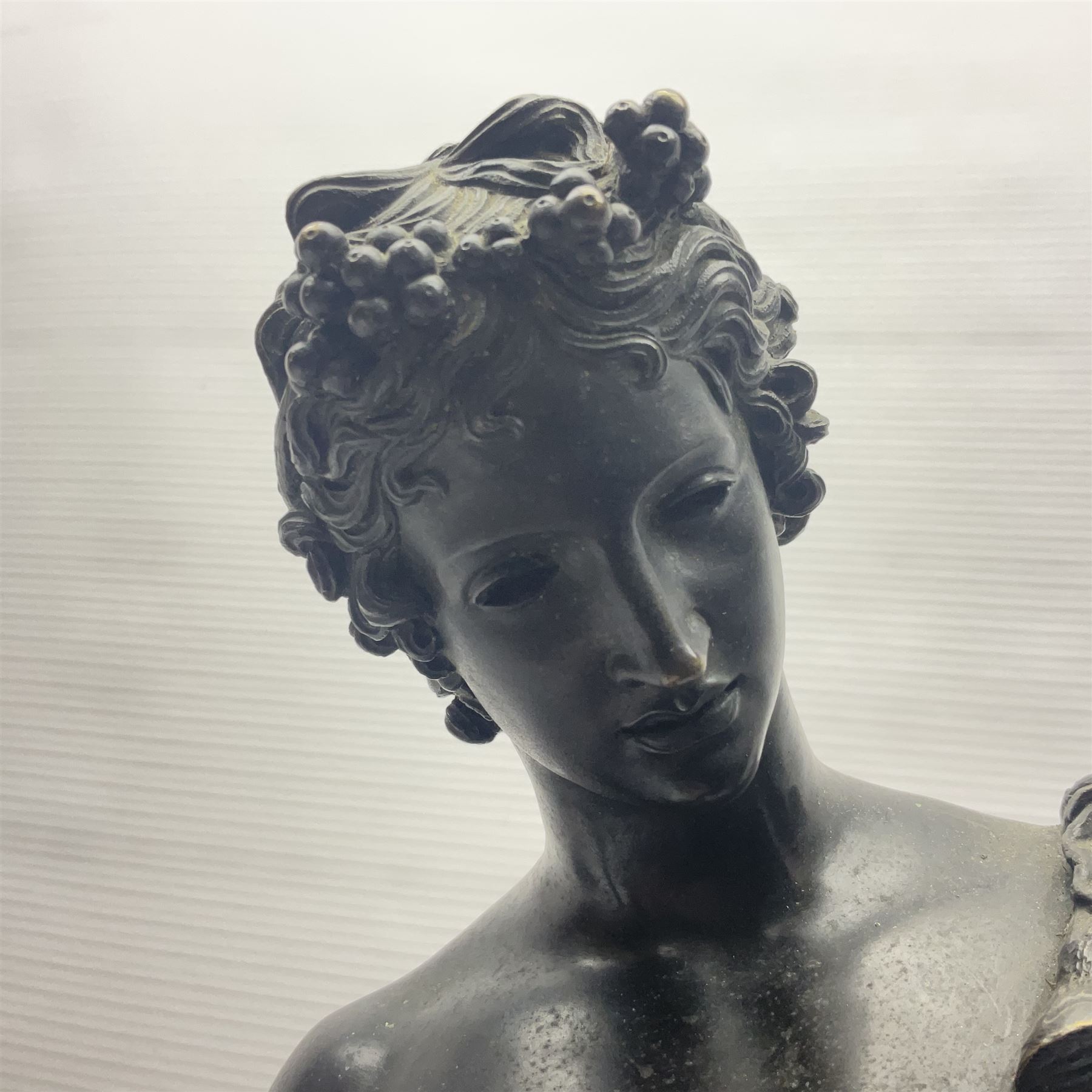 Bronzed classical nude male figure, upon a stepped circular base, H61cm 