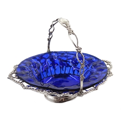 George III silver swing handled sweetmeat basket, open work design and applied foliate decoration, with blue glass liner, London 1765, silver approx 5oz