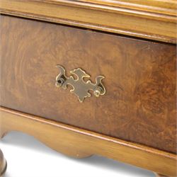 Georgian style walnut chest on stand, the figured top section fitted with four long drawers above a further drawer on the base, brass swan-neck handles, on turned legs joined by shaped stretchers with bun feet
