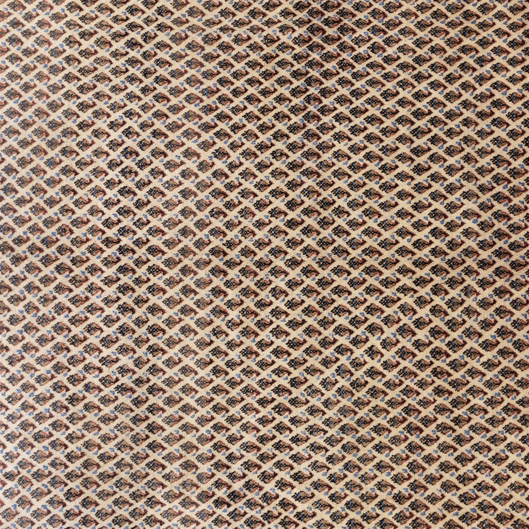 West Persian Botteh-Mir hand-knotted rug, ivory field decorated with an overall dense lattice design of small repeating boteh motifs in muted blue, rust, and brown tones, enclosed by a series of narrow borders incorporating stylized geometric and floral patterns with cotton fringe ends 