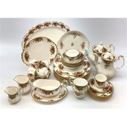  Royal Albert Old Country Roses tea and coffee wares comprising teapot, coffee pot, six trios, six breakfast bowls, six dinner plates, two sugar bowls, two jugs, cake plate, sauce boat and stand, coffee cup & saucer, matching Bone China oval platter & Royal Albert Moss Rose cake plate   