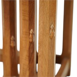Mouseman - oak nest of three tables, raised on octagonal supports, with carved mouse signature, by the workshop of Robert Thompson of Kilburn