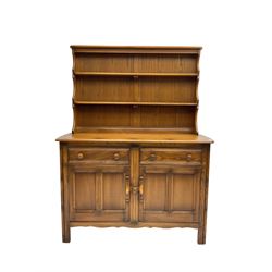  Ercol - 'Golden Dawn' kitchen dresser, two-tier plate rack over base, fitted with two drawers over two panelled cupboard doors