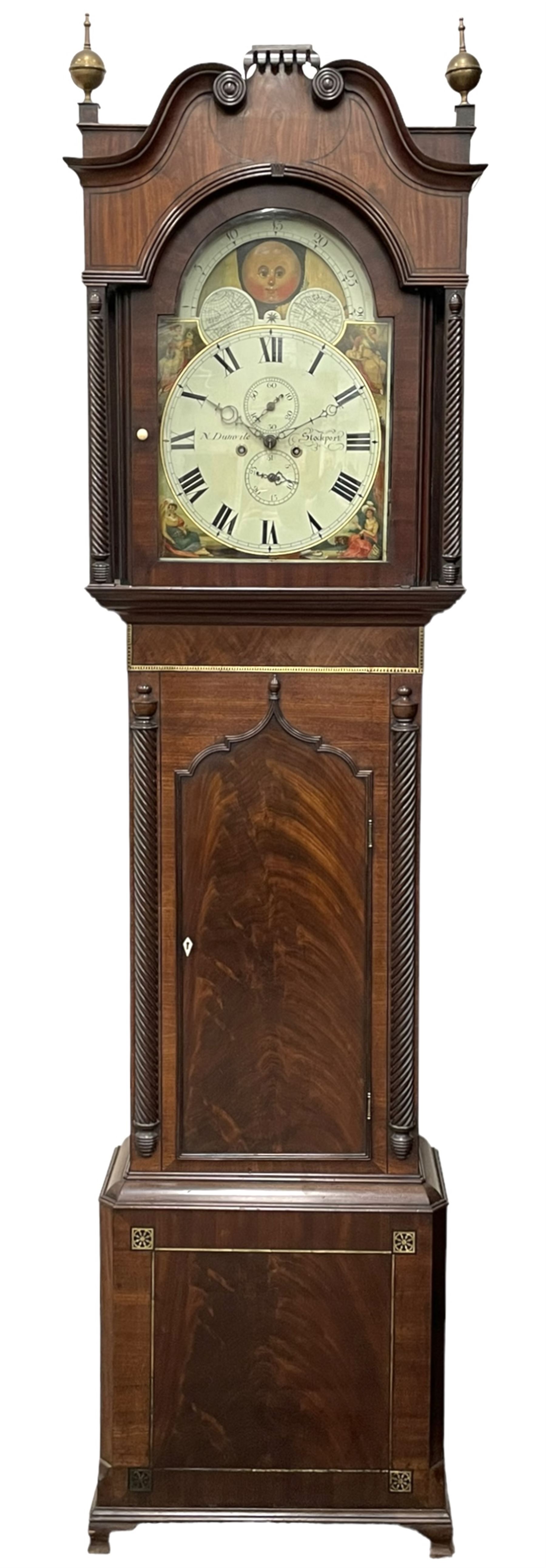 Nathaniel Dumville of Stockport - 8-day brass inlaid mahogany longcase clock c1840, swans neck pediment with ball and spire finials and wooden paterae, recessed break arch hood door flanked by rope twist pilasters, trunk with conforming pilasters and gothic ogee topped door, canted plinth raised on bracket feet, fully painted break arch dial with moon work and spandrels depicting the four seasons, centre with Roman numerals, minute track, subsidiary date and seconds dials, matching stamped brass hands, four pillar movement with an anchor escapement, rack striking on a bell. With weights and pendulum.
The Dumville family were prevalent Cheshire clockmakers working in Stockport 1820-42.

