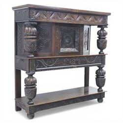 Jacobean revival oak side cabinet, rectangular top above carved frieze of stylised foliage...