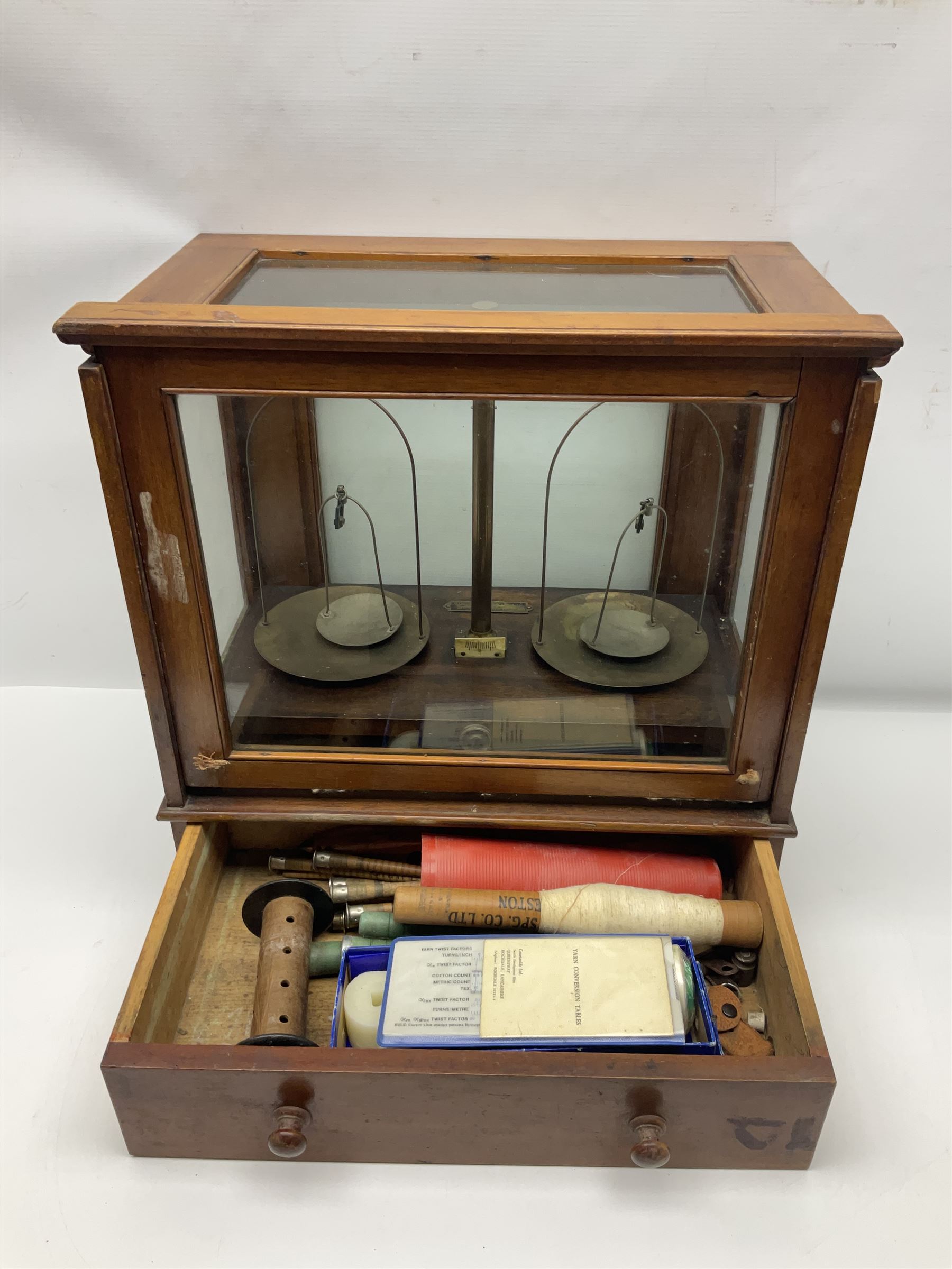 Collection of textile equipment, comprising, Goodbrand & Co. mahogany and brass yarn tester, Negretti & Zambra barograph and two sets of precision scales