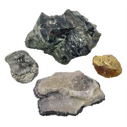 Four mineral specimens, the largest example comprising of various hardstone specimens in green red and brown hues, amber specimen and two others 