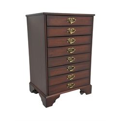 John Austin Furniture Ltd. - mahogany music cabinet, fitted with eight fall front drawers
