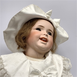  SFBJ 'Laughing Jumeau' bisque head doll with applied hair, sleeping brown eyes, open-closed mouth with teeth and tongue and composition body with jointed limbs, impressed marks 'SFBJ 236 Paris 12', H60cm    