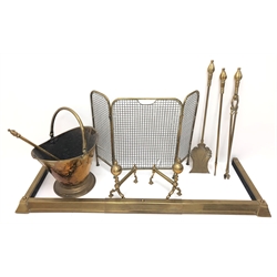  Victorian three piece brass companion set with matched coal fork, pair brass fire dogs, brass mesh folding spark guard, 19th century coal bucket and brass fender, L133cm x D44cm   