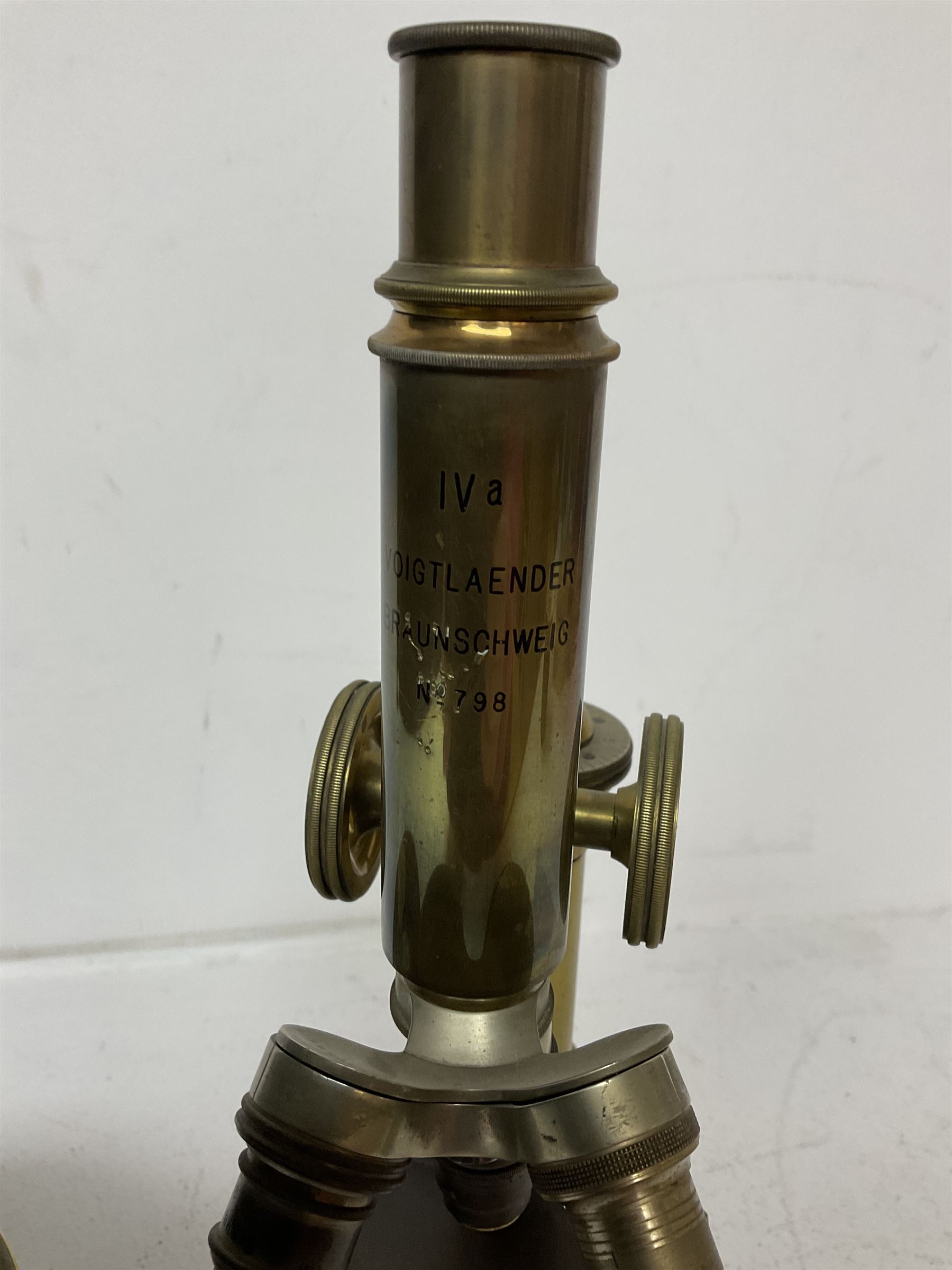 Early 20th century lacquered brass microscope stamped 'VOIGTLAENDER BRAUNSCHWEIG no 798' and Sestrel brass cased compass