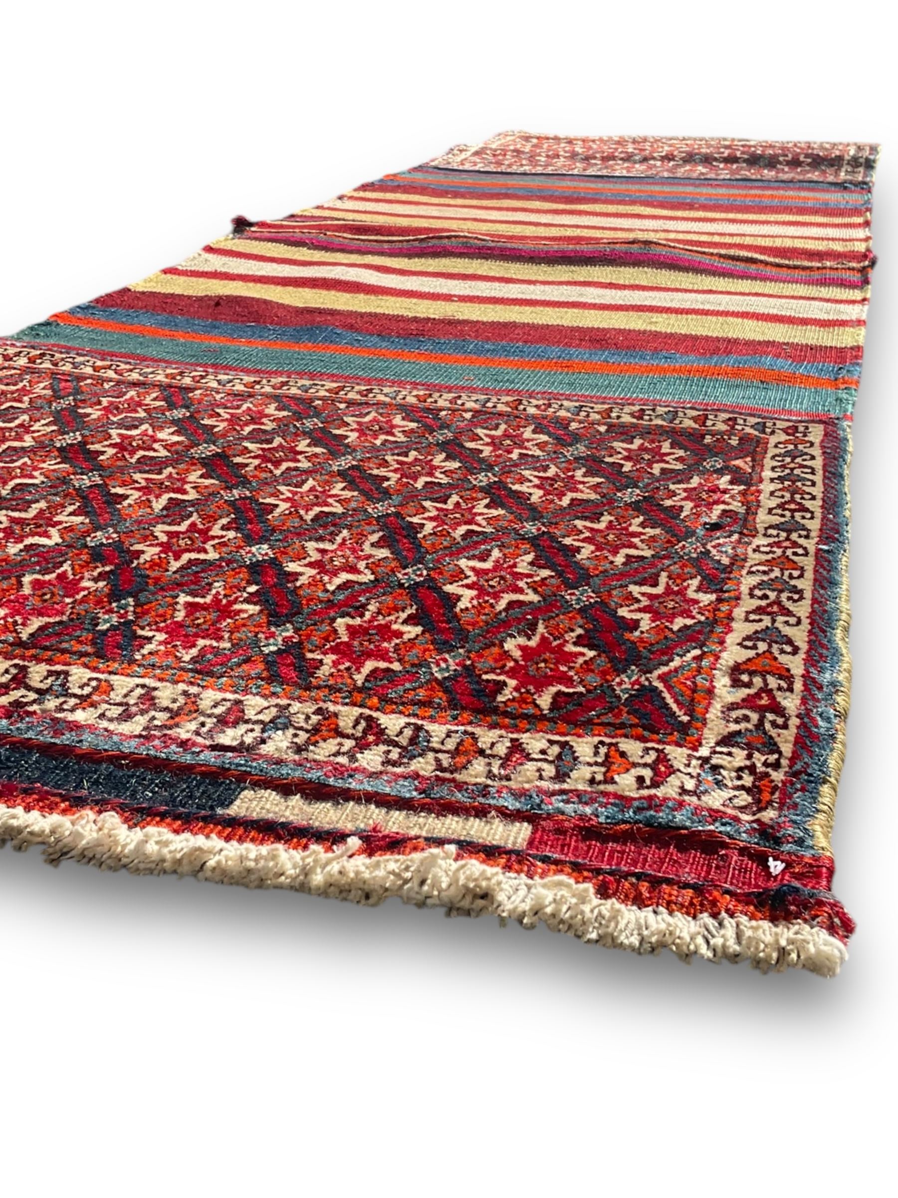 Southwest Persian Qashqai saddle bag, red and ivory ground with diamond-shaped star motifs in the top and bottom panels, central field decorated with alternating horizontal stripes