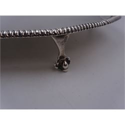 Early 20th century silver waiter, of hexagonal form, with oblique gadrooned rim, upon four ball and claw feet, hallmarked Goldsmiths & Silversmiths Co Ltd, London 1919, D21cm