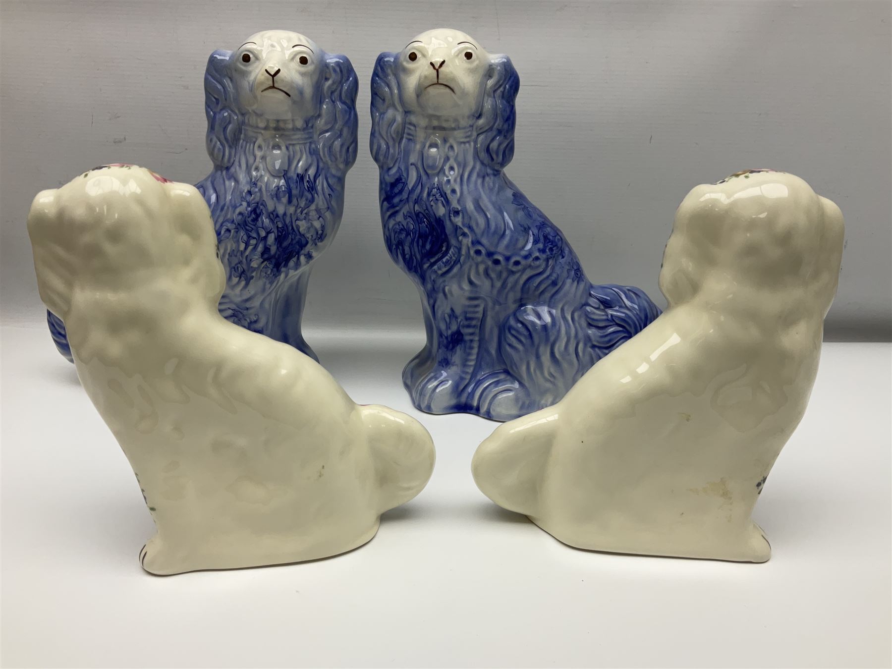 Three Pairs of Staffordshire style dogs, together with two Staffordshire style jugs, largest example H30cm 