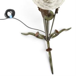 Arts and Crafts wrought iron and copper standard lamp, the openwork stem centred by a cut-glass reservoir with arrow-cut decoration, applied with stylised copper leaves, on shaped tripod base