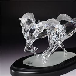 Swarovski, Wild Horses, modelled as two galloping horses upon a wooden plinth, limited edition 3915/10000, with certificate and case, H20cm