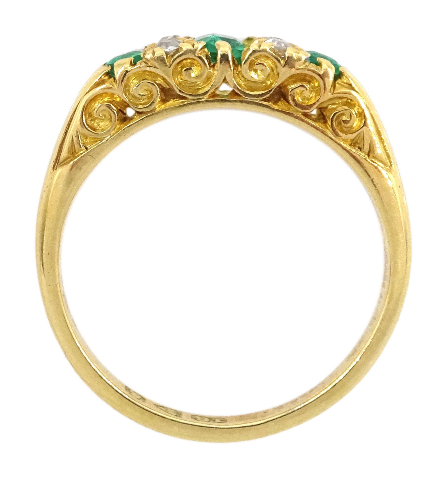 Edwardian 18ct gold three stone emerald and four stone old cut diamond ring, Chester 1905