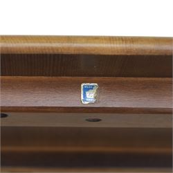 Ercol - Dark elm coffee table, plank top with chamfered edges, over a central under tier spindles, tapered legs 