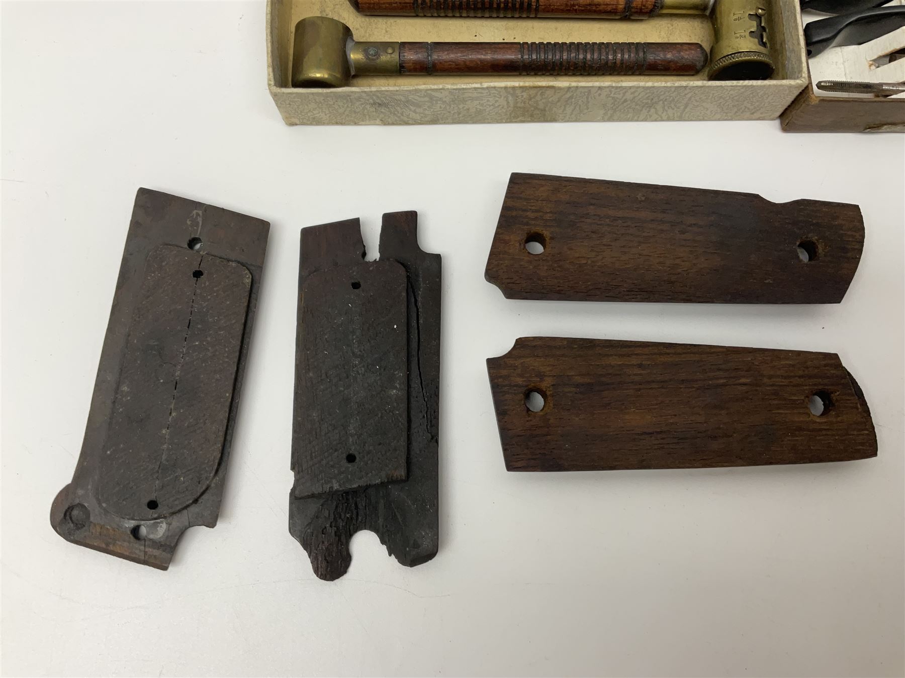 Six pairs of revolver grips;  pair of Lightwood & Son Ltd powder/shot measures in original box; and boxed Colt hammer shroud 
