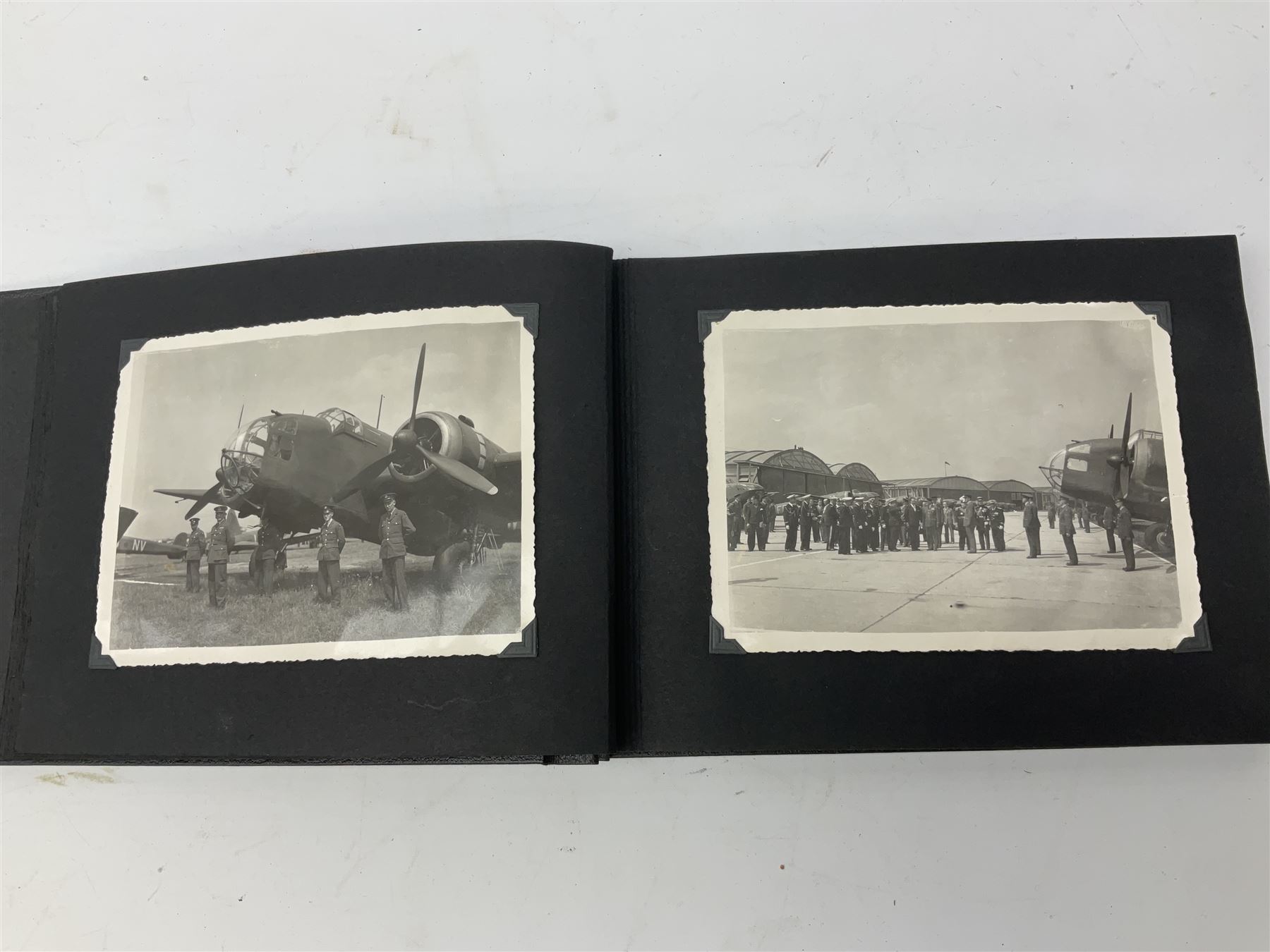 144 Squadron RAF - album containing over one hundred photographs and postcards of varying sizes including group shots, aircraft on the ground and in the air, German aircraft, crashes etc; sizes from 3.5 x 6cm to 16 x 21cm; and quantity of modern reference material
