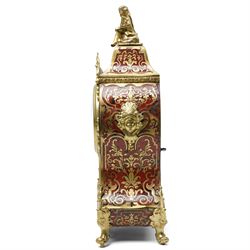 Rollin à Paris - 19th century French Louis XV style ormolu-mounted red tortoiseshell and brass Boulle-work mantel clock, surmounted by a seated musical putto above a waisted case applied with mask, rocaille, foliate and dolphin mounts, the gilt dial with white enamel Roman numeral cartouches, twin-train movement striking on a bell, signed and numbered 480, on four scrolling foliate feet