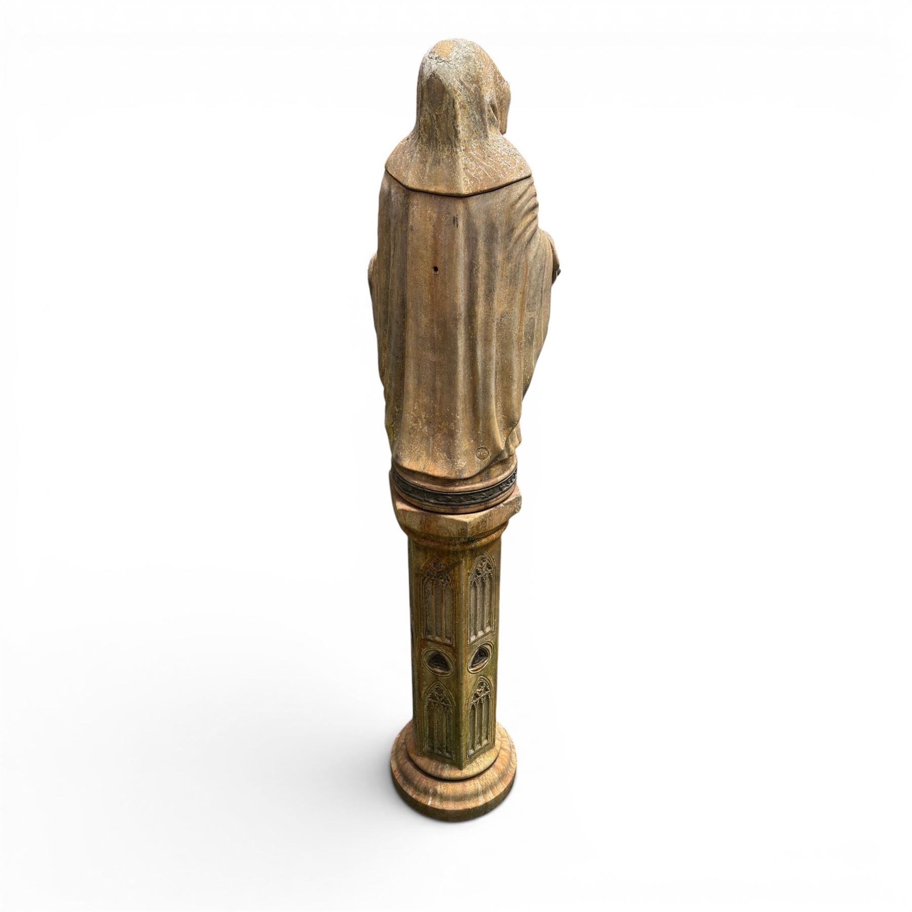 Farran stone garden statue depicting a hooded monk standing in flowing robes in circular form, set upon Gothic pedestal with arched panels, featuring lead hands and script band