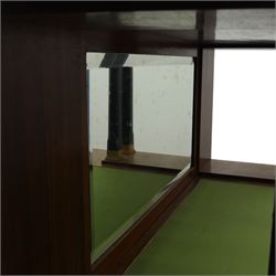 Continental Art Nouveau cocktail cabinet, the stepped cornice over a glazed upper section with panelled doors, enclosing fitted shelf, the central section with mirrored back and green baize serving surface flanked by ebonised and gilt detailed pilasters, the base fitted with cupboard doors inlaid with stylised foliate and geometric motifs, on a plinth base