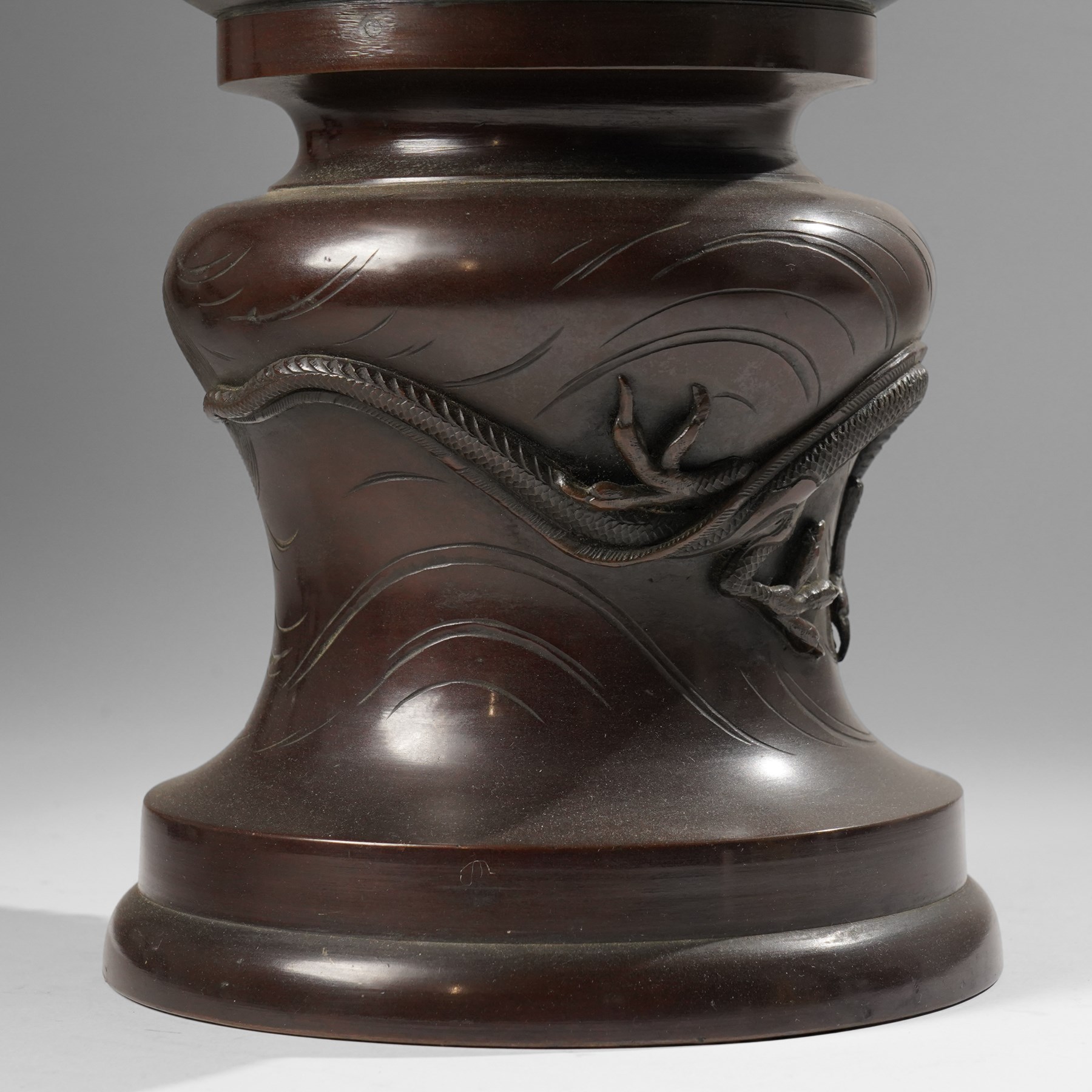 Japanese late Meiji period bronze koro and cover, surmounted by an eagle finial and with bird decoration in high relief to each side, twin elephant trunk handles, bearing indistinct character signature to one side, H82cm