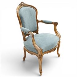 Louis XV design giltwood open armchair, shaped upholstered back with carved foliate cresting, padded scroll arms and serpentine seat upholstered in pale blue fabric with studwork, moulded and foliate carved frame, on cabriole supports with scroll feet