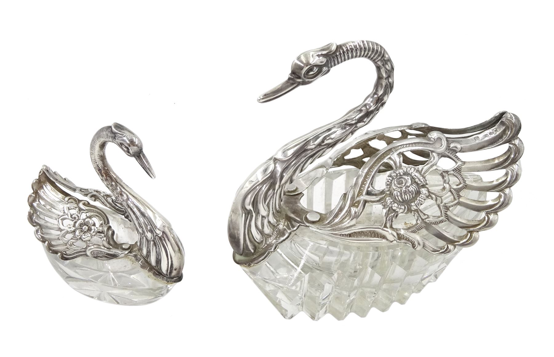 Silver mounted cut glass swan dish, with pierced and embossed hinged wings and a smaller silver swan salt, both by E Ltd,  London import marks 1973/75