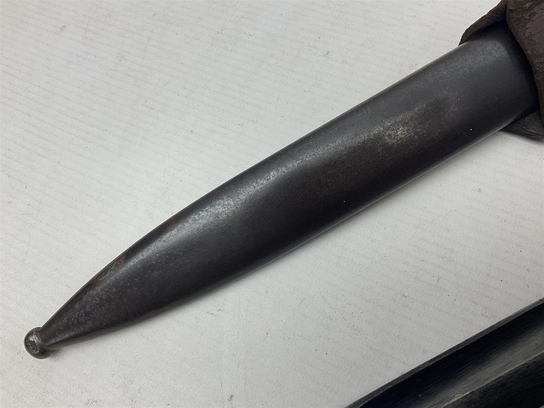 WWII German K98 Mauser bayonet by E. & F. Horster, the 24.5cm fullered blade marked 43aSW for 1943, numerous inspection marks to blade and pommel, bakelite grips and bluing to metal parts; in steel scabbard with corresponding numbers and leather frog L42cm overall