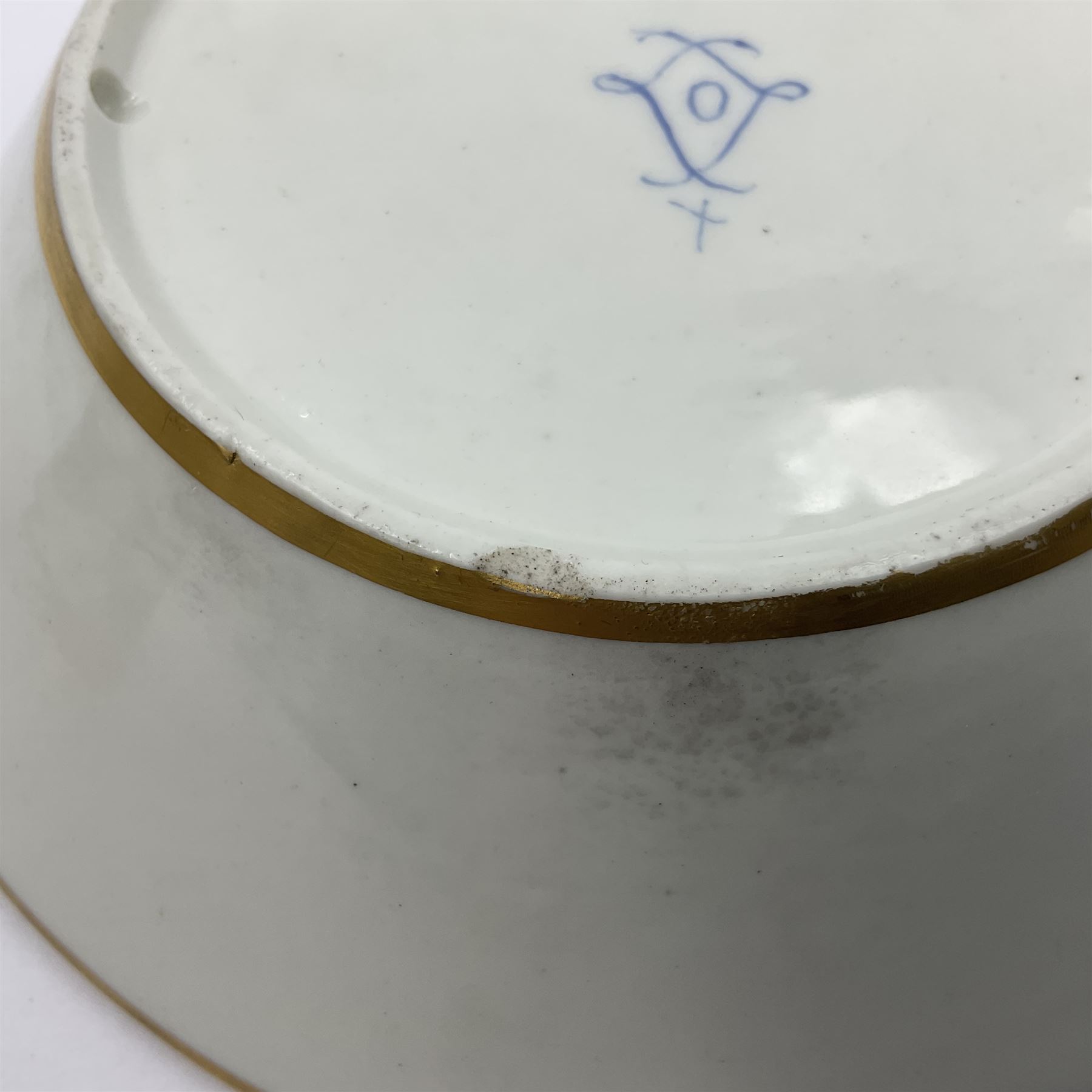 Sèvres soft paste porcelain coffee can and saucer with date code for 1767, painted with floral and laurel leaf garlands within blue scalloped and gilt borders, interlaced LL monogram enclosing the date letter O above painters mark for Catrice, coffee can H7.5cm, saucer D15cm