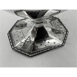 Victorian silver four piece tea service, comprising teapot, teapot stand, twin handled open sucrier and milk jug, each of octagonal form with foliate bud border and engraved decoration including crest to canted panels, and vacant panels, the teapot with ivory finial to the hinged cover and later wooden handle, hallmarked Edward Barnard & Sons Ltd, London1896, teapot including finial H15cm, milk jug including handle H16cm, teapot stand W11.5cm

This item has been registered for sale under Section 10 of the APHA Ivory Act