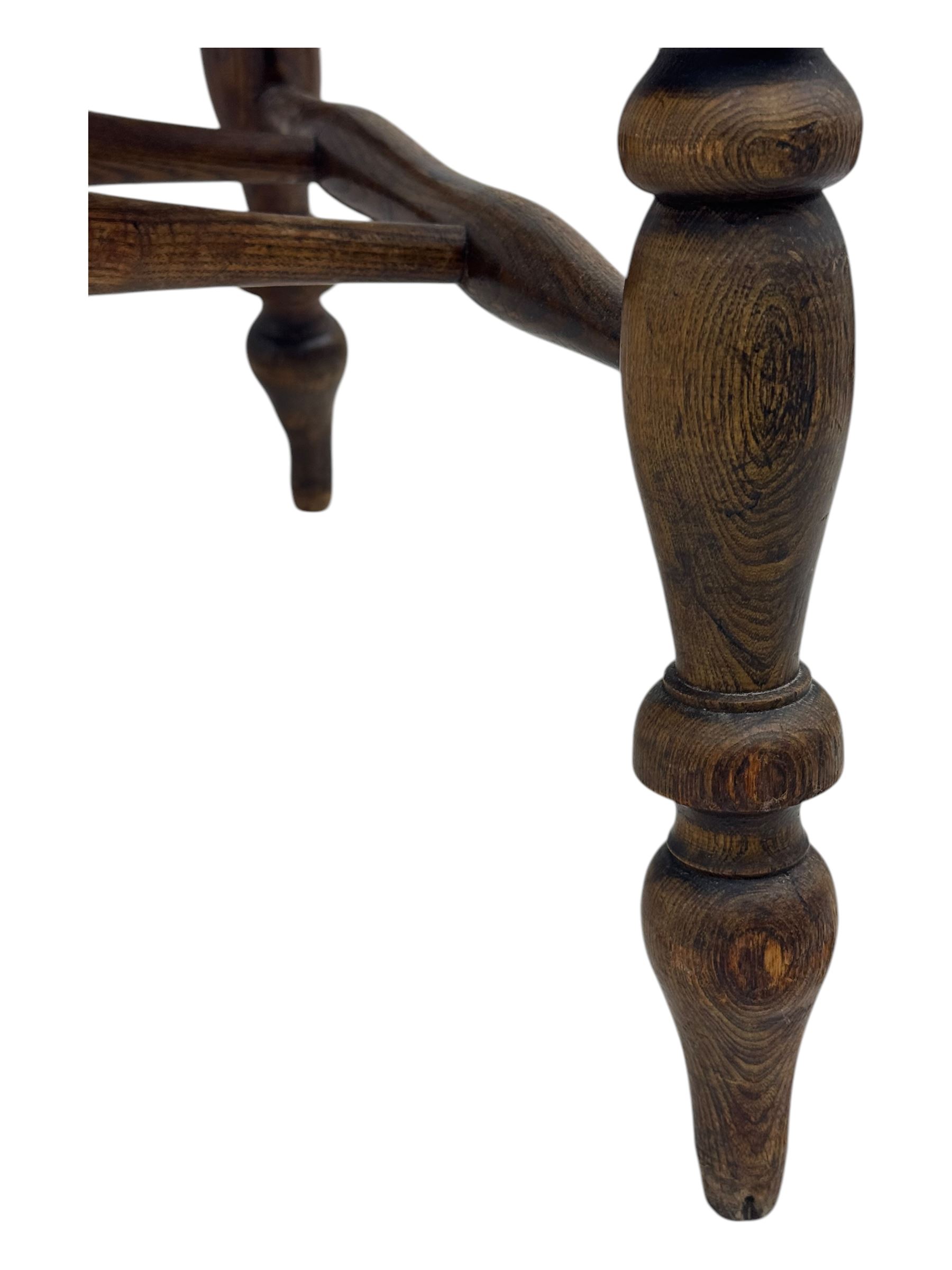 19th century elm and beech smoker's bow armchair, shaped arms over turned spindle gallery and dished seat, on turned supports united by double H-shaped swell turned stretchers 