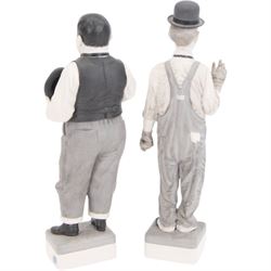 Pair of Spanish Algora Personajes Del Cine figures, modelled as Stan Laurel and Oliver Hardy, with printed marks beneath, both with certificates of authenticity, H37cm