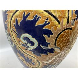 Oriental crackle glaze floor vase decorated with a dragon upon a blue ground, H66cm
