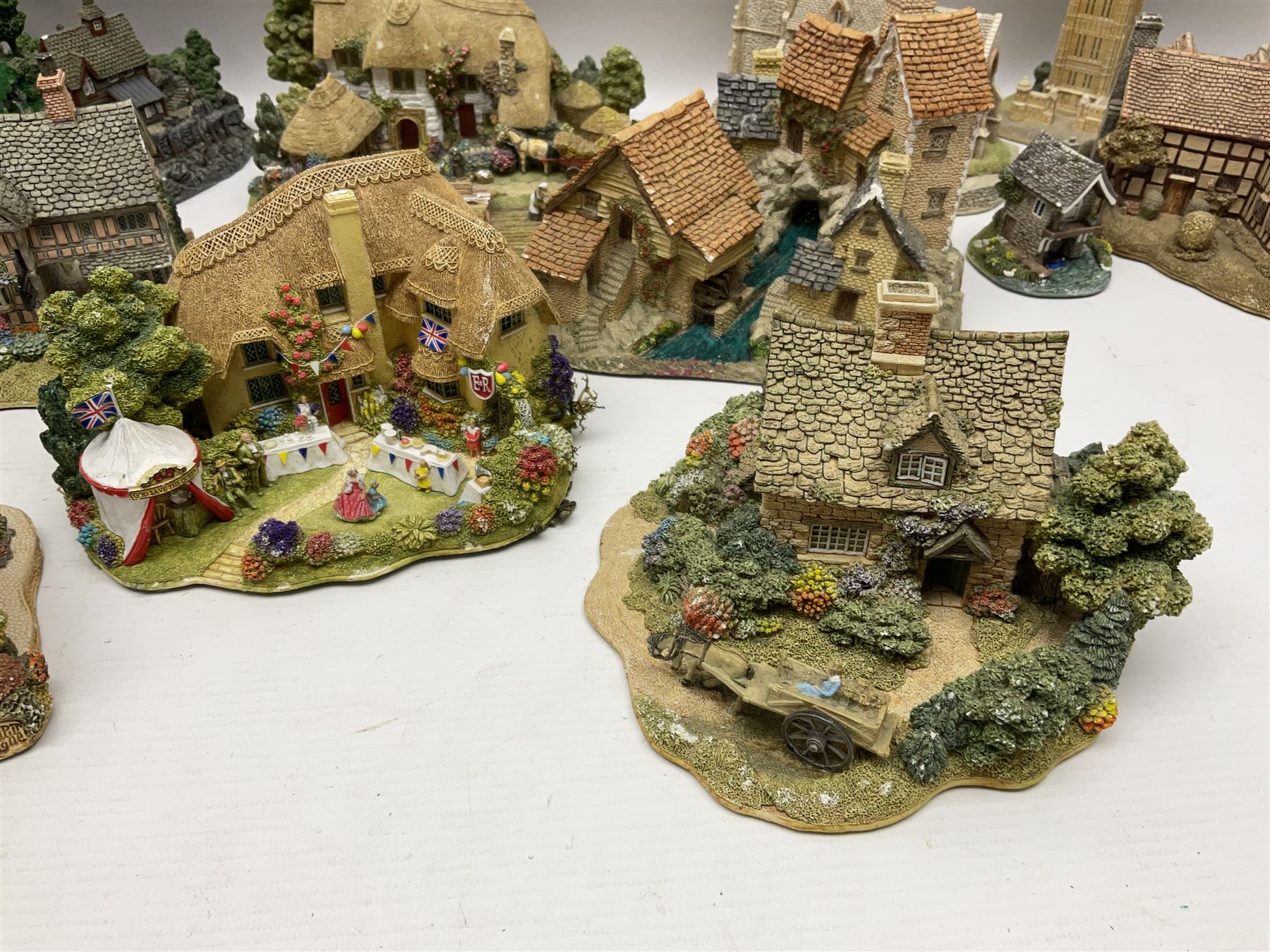Twenty six Lilliput Lane models, to include Golden Harvest, Junk and Disorderley, Heaven Lea Cottage, Old Scrumpy Farm, Chantry Chapel Wakefield, etc, together with four similar cottages