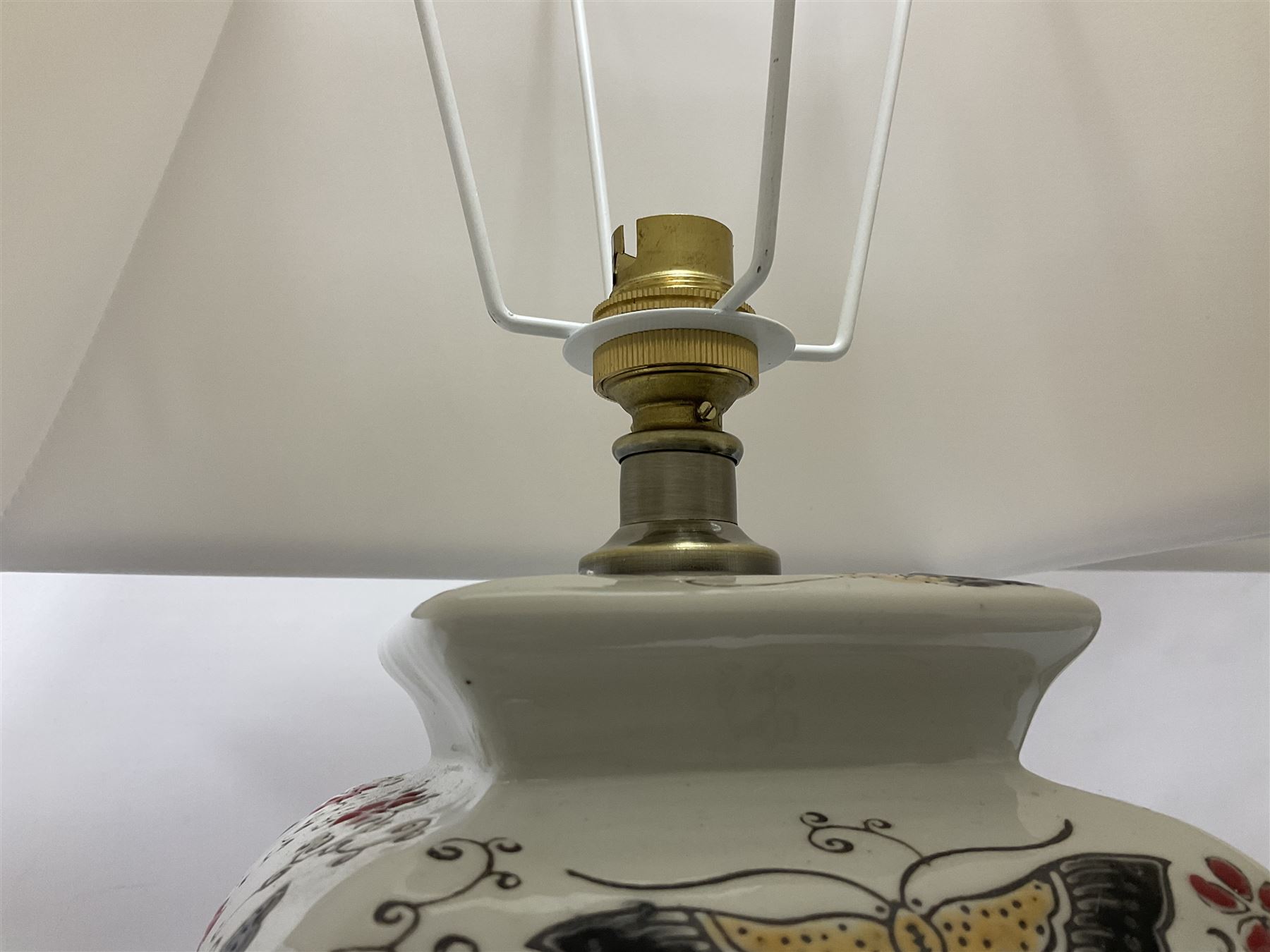 Pair of table lamps of square baluster form, decorated in a butterfly motif, upon a square base, including shade H55cm