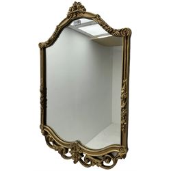 Gilt framed wall mirror, shaped cresting rail decorated with flower heads, the upright rails with further floral decoration over open scrolling foliate, plain mirror plate