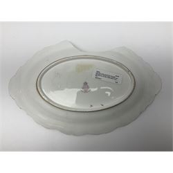 Early 20th century Royal Worcester dish decorated by Thomas Lockyer, oval form with gilt shaped rim and twin shell handles, hand painted with a still life of fruit upon a mossy ground, signed T Lockyer, with puce printed mark beneath and date code for 1922, for restoration, W31cm