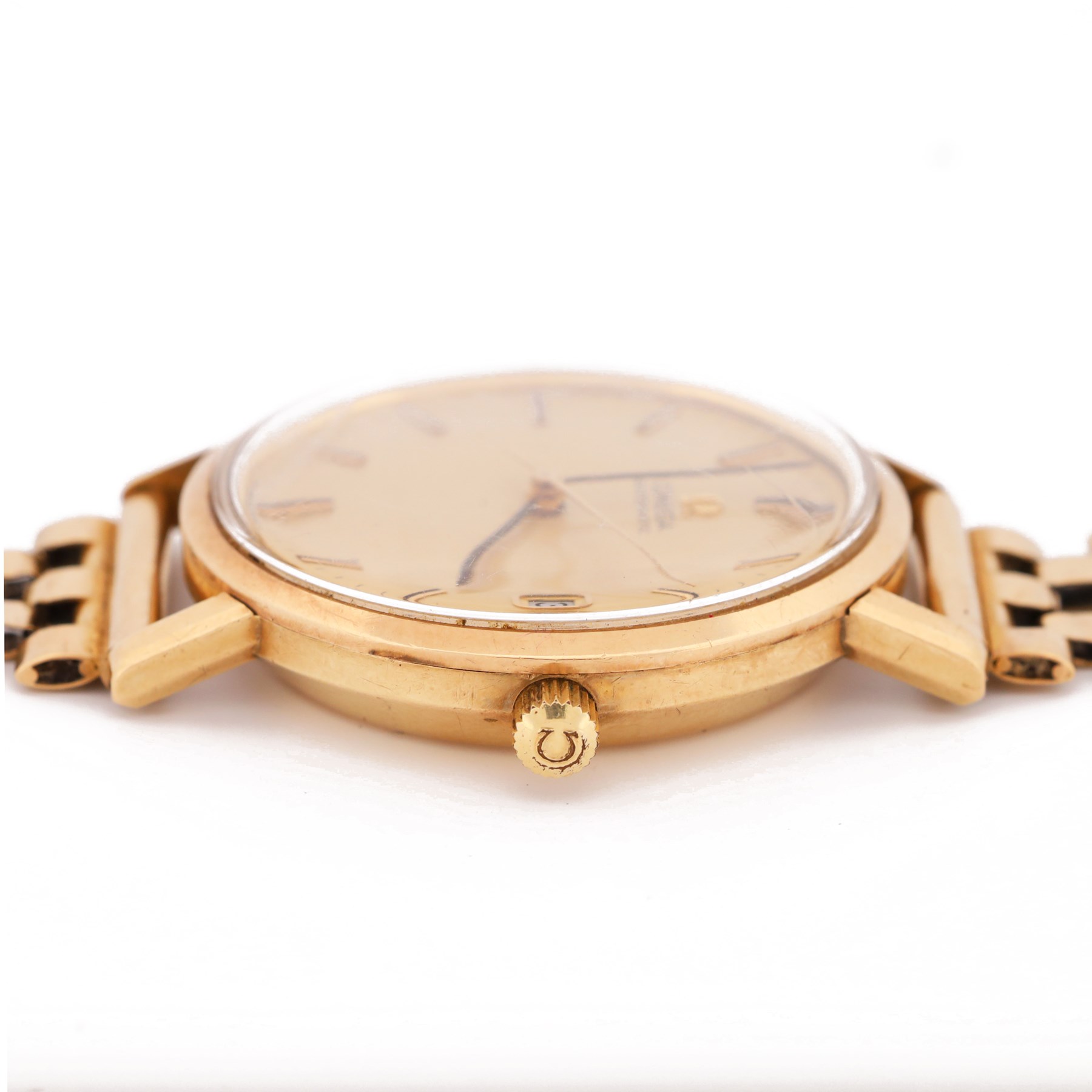 Omega gentleman's 9ct gold automatic wristwatch, gilt dial with baton hour markers and date aperture, back case engraved Tool 106, on a 9ct gold brick link bracelet, London 1976