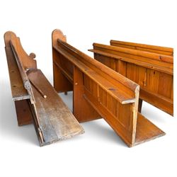 Set of four early 20th century single-ended stained pine ecclesiastical church pews, the shaped end support flanking slatted and panelled back