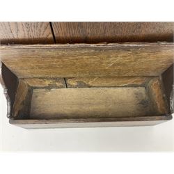 George III oak spoon rack and candle box, the rectangular backplate with shaped  pediment and two six aperture spoon racks, above a candlebox with hinged cover, with various brass spoons and a pair of brass candle snuffers, H56.5cm, W35cm, D14cm 