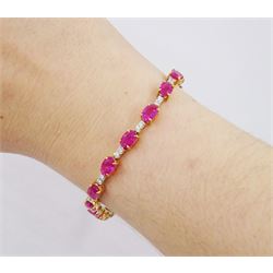 18ct gold oval ruby and round brilliant cut diamond bracelet, stamped 750, total ruby weight approx 10.55 carat, total diamond weight approx 0.55 carat