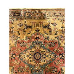 Persian design rug, gold ground and decorated with trailing foliage and plant motifs