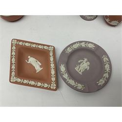 Collection of Wedgwood Jasperware, in orange, lilac and pink colourways, including oval tray, small jug, trinket boxes, trinket dishes, etc , all with impressed mark beneath